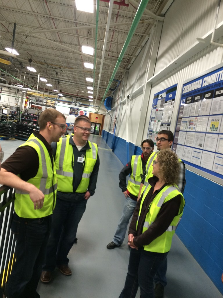 A group from Pella Windows toured Eaton Corp. and power management company and maker of electrical supplies in Urbandale.