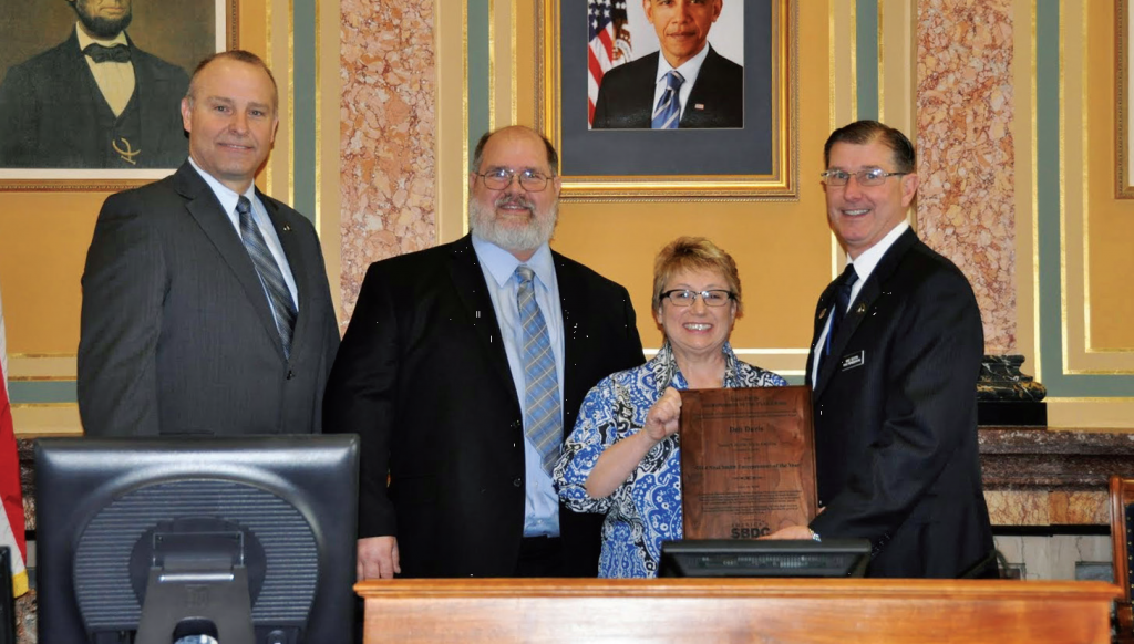 Deb Davis is honored at the Iowa Capitol earlier this year after being named Entrepreneur of the Year.