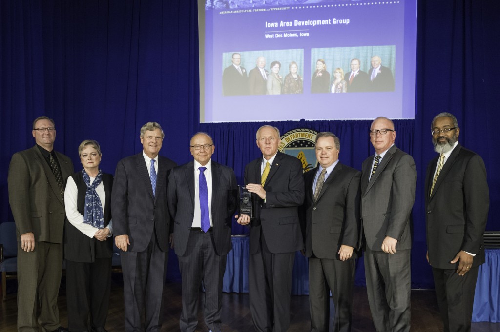 Pictured are Bruce Hansen and Sue Cosner, IADG; Secretary of Agriculture Tom Vilsack; IADG Board Chair Dennis Murdock; IADG President Rand Fisher; Bruce Nuzum and Mike Meissen, IADG; and USDA Assistant Secretary for Administration Dr. Gregory Parham