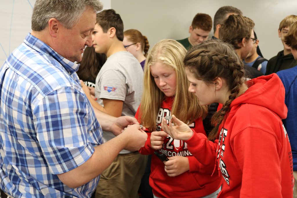 Boone High School Students speak with Chris Hill about parts made with an Iowa State University 3D metal printer. 