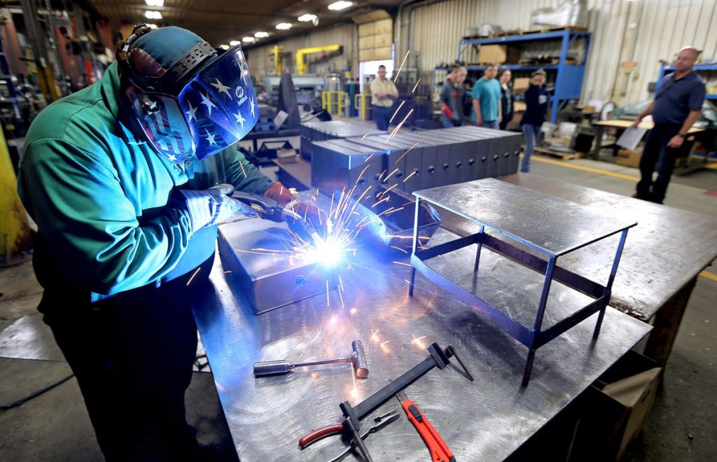 Maquoketa High School students toured Precision Metal works earlier this month. (Dave Kettering, Dubuque Telegraph-Herald)