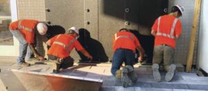 Workers install a flood panel for a Floodproofing.com client. 