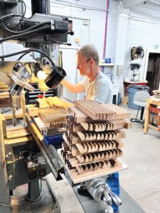 Dobson employee machining pallets, which are made of vertical grain (quarter-sawn) western red cedar.