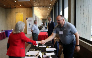 Senator Joni Ernst with table exhibitor