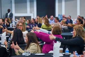 ILC Conference attendees giving thumb