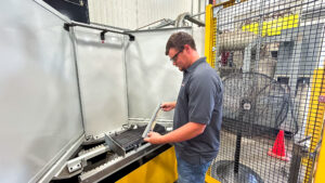 Employee working with a part at Kooima Ag.