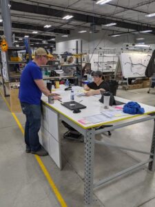 Timberline employees on production floors.