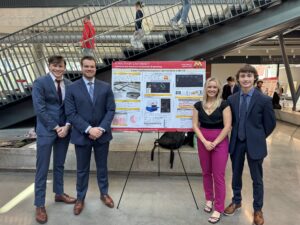 ISU students presenting senior capstone project poster.